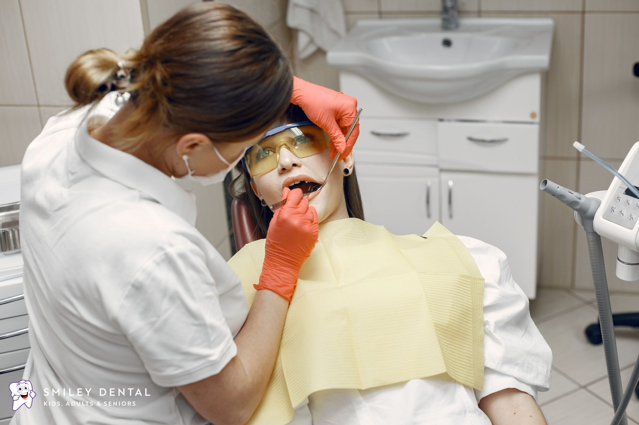 Dentist examining a calm patient during a comfortable dental visit in Beverly, MA