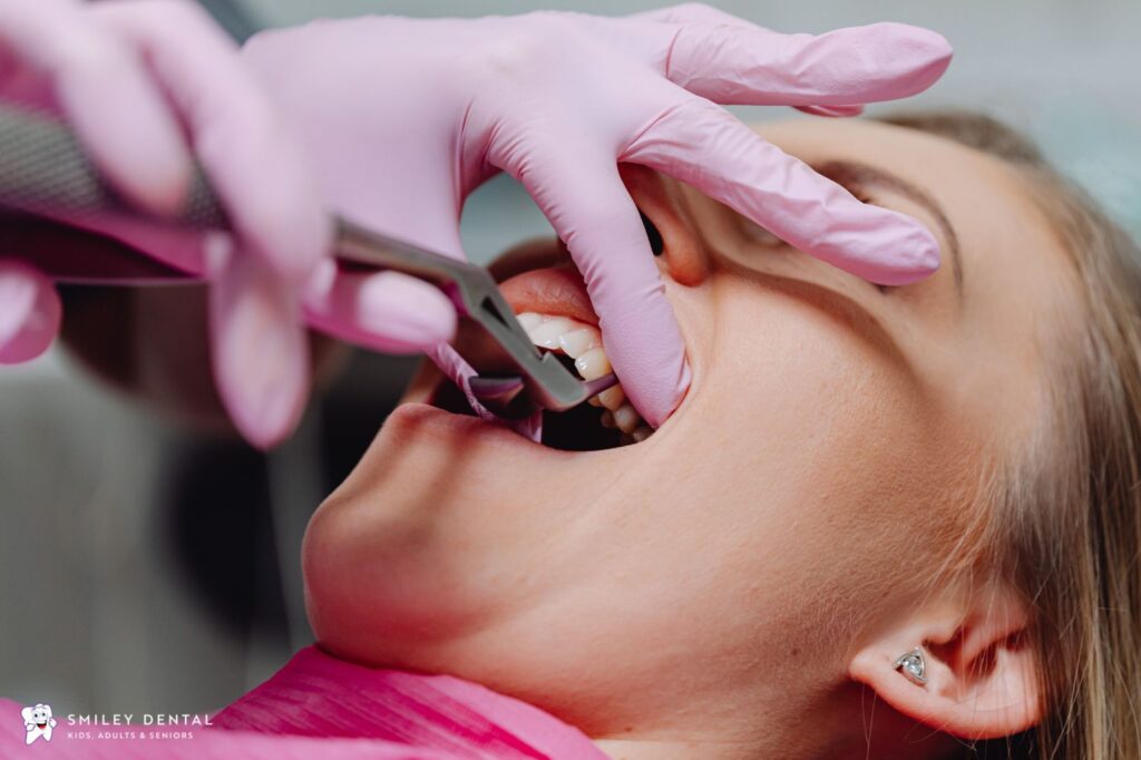 Dentist examining a patient's teeth and gums during a dental appointment